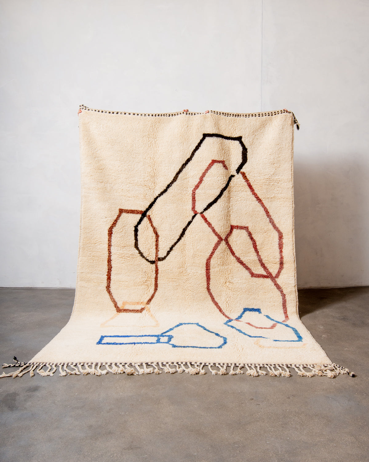 Modern, designer, handcrafted Berber rug from Morocco. Beniourain carpet with beautiful colours and patterns and fluffy wool texture.